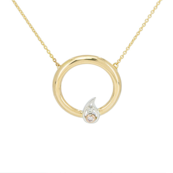 Yellow gold necklace circle with a white gold leaf design surrounding a white and light pink diamond