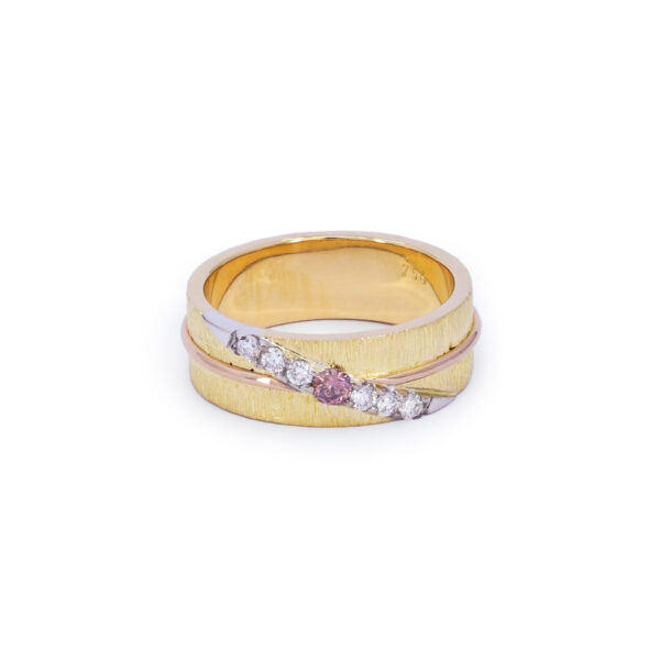 Textured yellow gold ring set with an extremely rare intense pink diamond