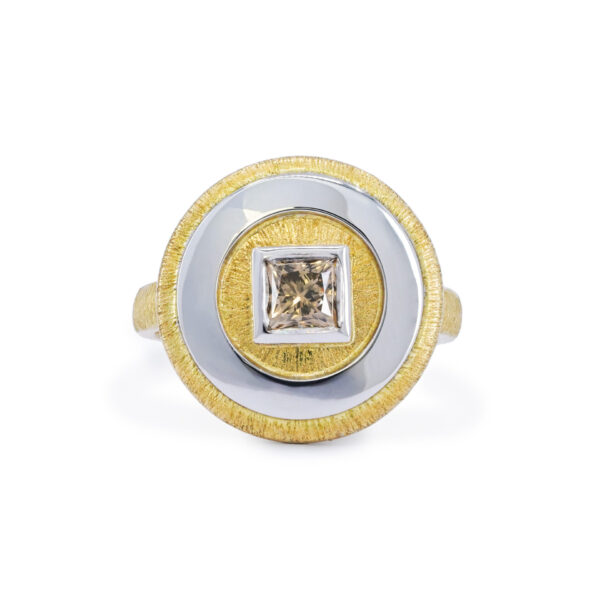 Circle textured yellow gold ring with a large champagne diamond set in high chrome white gold.