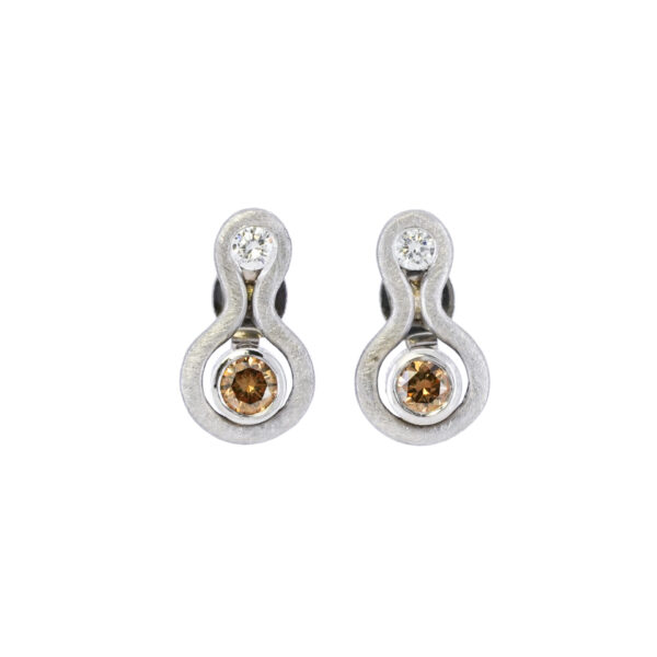 A pair of argyle diamond stud earrings with champagne and white diamonds.